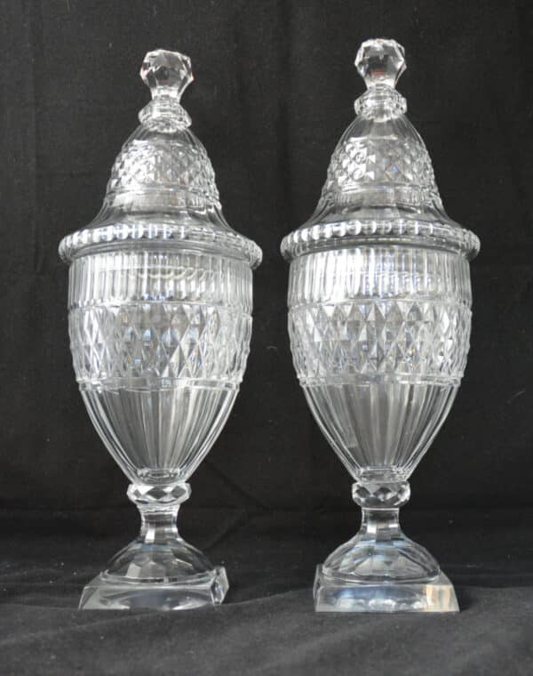 A pair of glass Urns with covers