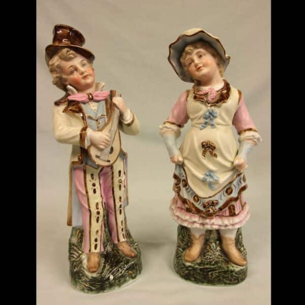 Antique Glazed & Bisque Porcelain Pair of Figurines.