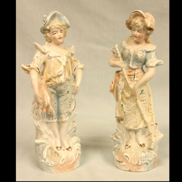 Pair of Bisque Figurines of Young Boy & Girl.