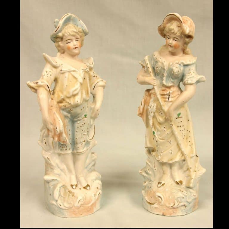 Pair of Bisque Figurines of Young Boy & Girl.