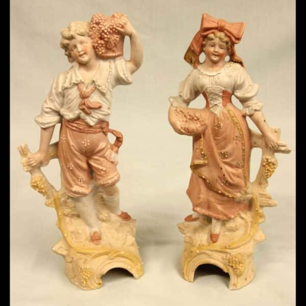 Pair of Bisque Figurines of Young Girl & Boy
