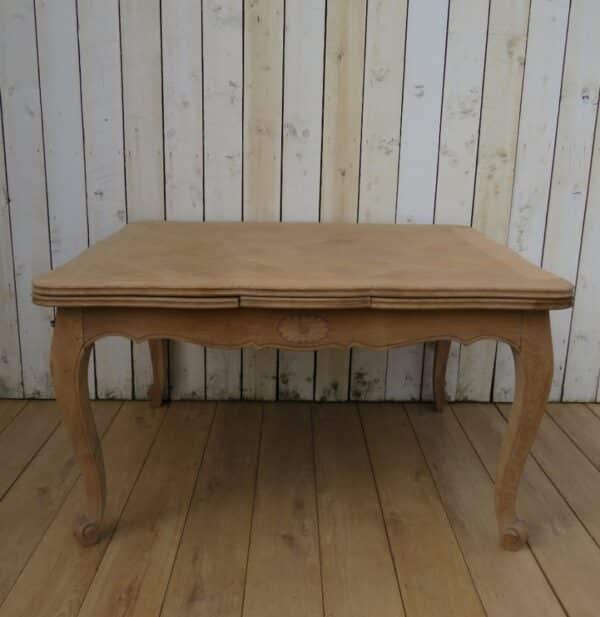 Extending Bleached Oak Draw Leaf Dining Table