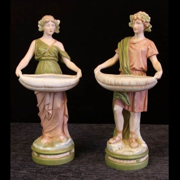 Pair Antique Royal Dux Porcelain Figurines of young man and woman