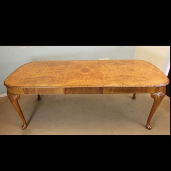 Burr Walnut Queen Anne Style Extending Dining Table.