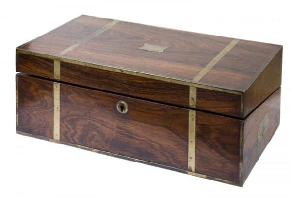 An early 19th Century brass bound rosewood writing box