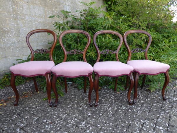 Set of 4 walnut balloon back dining chairs circa 1880.