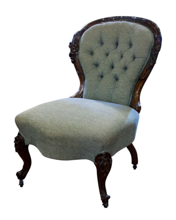 Victorian carved walnut framed button backed easy chair