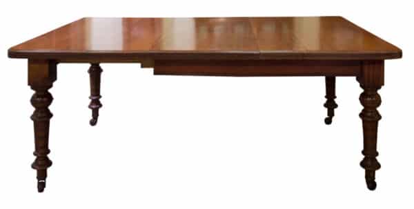 A Victorian and Walnut wind-extending table - Image 2
