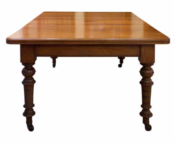 A Victorian and Walnut wind-extending table - Image 4