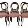 A set of 6 Victorian walnut balloon back dining chairs