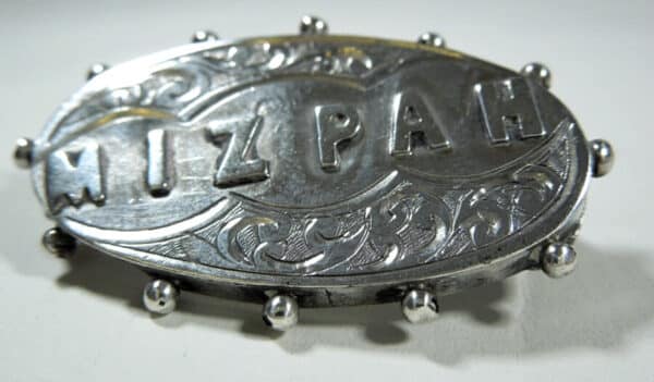 silver Mizpah brooch