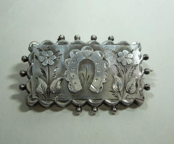 silver horseshoe brooch