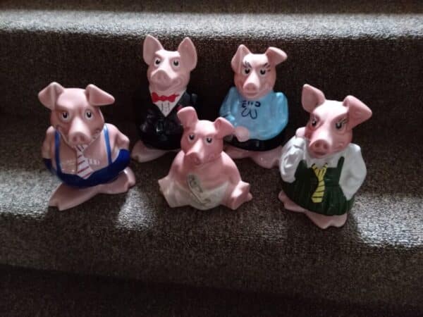 A NATWEST FAMILY OF MONEY BOX PIGS.