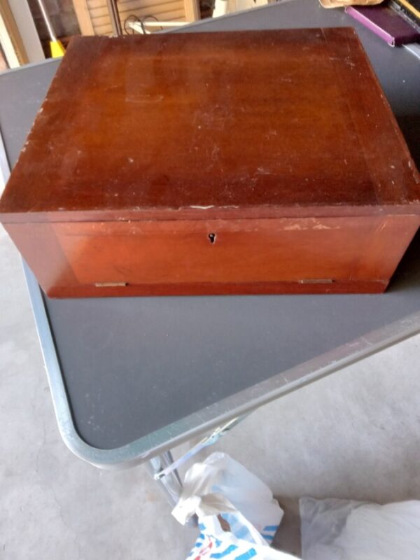 A COLLECTORS COIN BOX WITH SO MANY COINS IN.