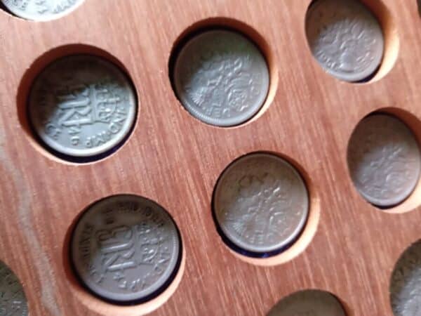 A COLLECTORS COIN BOX WITH SO MANY COINS IN. Coins 4