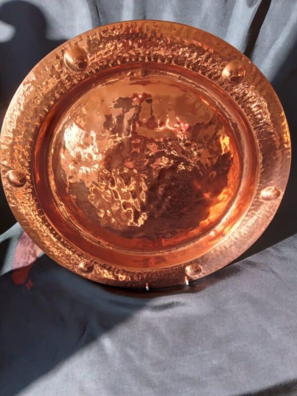 AN ART DECO LARGE COPPER CHARGER
