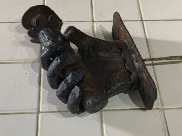 Wrought iron hand holding a spills converted to electric