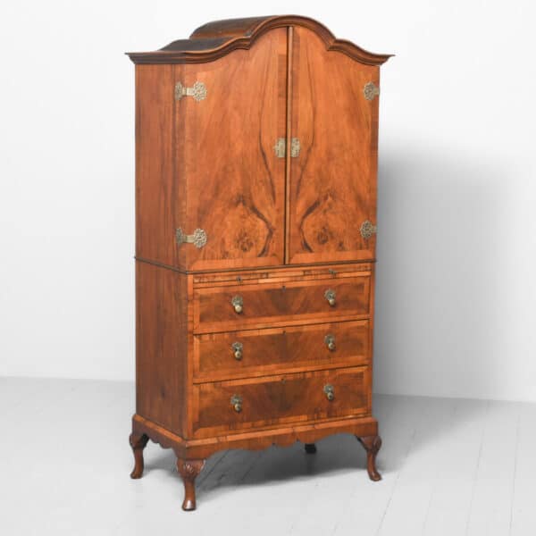 A WALNUT BEDROOM CABIINET/LINEN PRESS WITH CLOTHES FOLDER