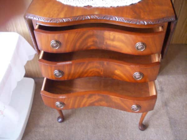 A SERPENTINE BEDSIDE CABINET WITH SIDE FLAPS Antique Furniture 4