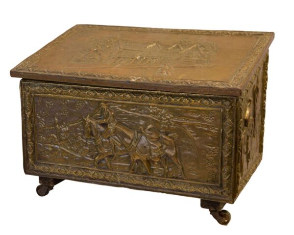 An embossed brass log/coal box