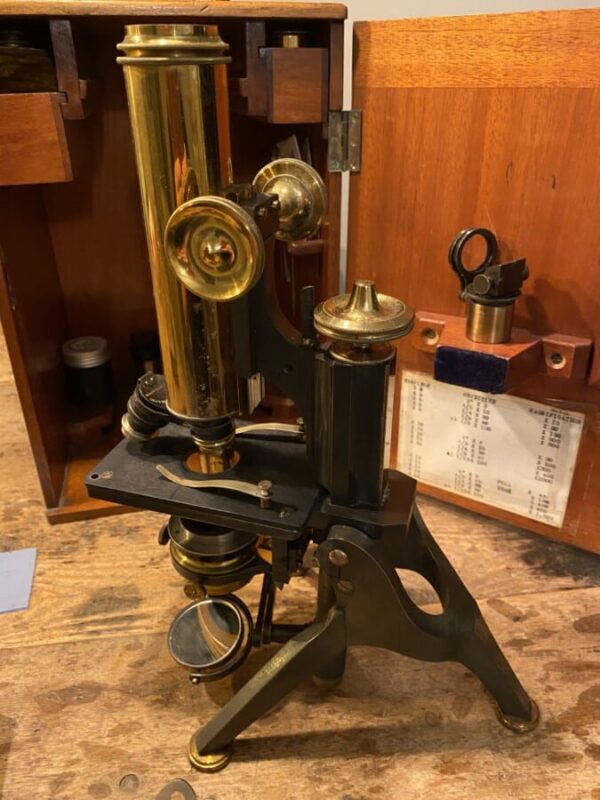 W Watson antique microscope with case and accessories.