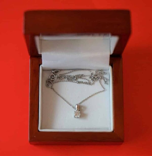 This is a beautiful vintage 750 Platinum 25 point Diamond Pendant