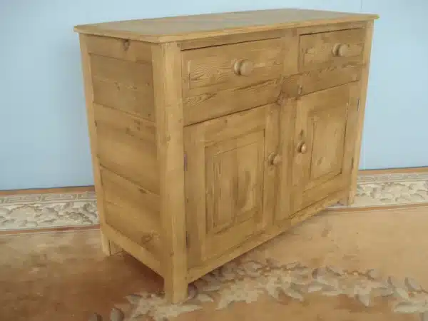 A Panelled Small Old Pine Dresser Base on stile supports