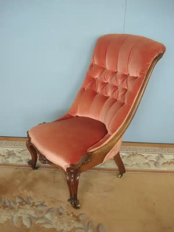 Ornately carved button back nursing chair