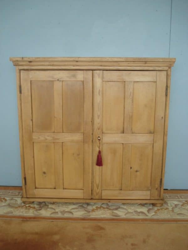 Four Panel Doors to this 19th Century Pine Cupboard