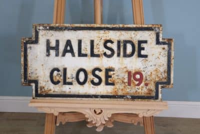 A large cast iron original Victorian street sign marked ‘Hallside Close’.