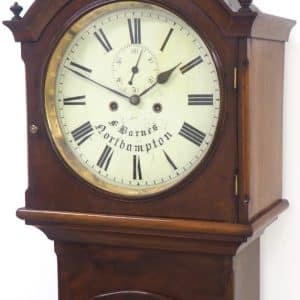 19THC Northampton 8 Day Longcase Clock Mahogany Case Signed Painted Round Dial Grandfather Clock Fine longcase clock Barnes Northampton English Wonderful painted dial with seconds subsidiary dial Mahogany case 8-Day striking movement sought after carved pediment and round dial 12 Inch arched dial Movement & case C1810 Working order Measures 180cm up by 45cm wide & 25cm deep English mahogany cased longcase clock design wonderful mahogany wood with a square dial. The twin weight driven movement is very clean and working well keeping good time striking a bell on the hour. The clock has a wonderful patina all original fine English Longcase. Very good condition for age, showing slight signs or age please view the many photos make sure happy.