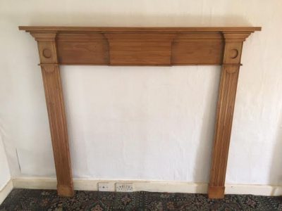 A Victorian pine fire surround