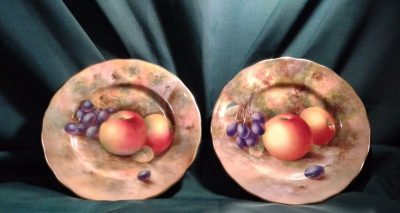 SOLD A pair of Worcester fallen fruits cabinet plates. Harry Ayrton