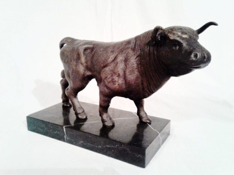Early 20th century Bronze Long horn bull on a marble plinth.