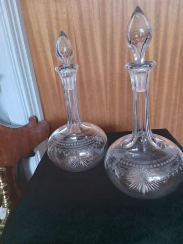 PAIR OF BULBOUS WINE DECANTERS. 29cm in height