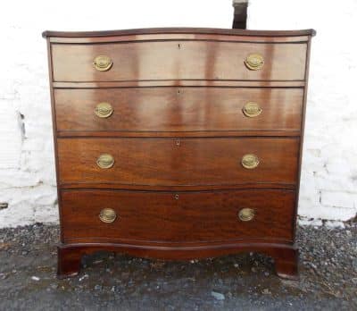 Georgian serpentine plum pudding mahogany chest of drawers