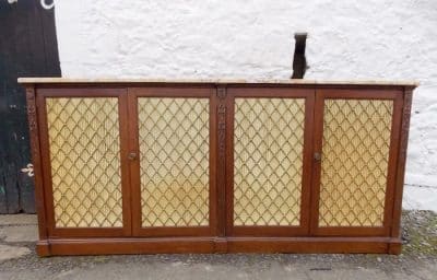 SOLD A Regency mahogany stained four door bookcase cabinet.