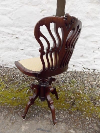 Edwardian mahogany Swivel chair. By Jas Shoolbred and Co. London. - Image 2