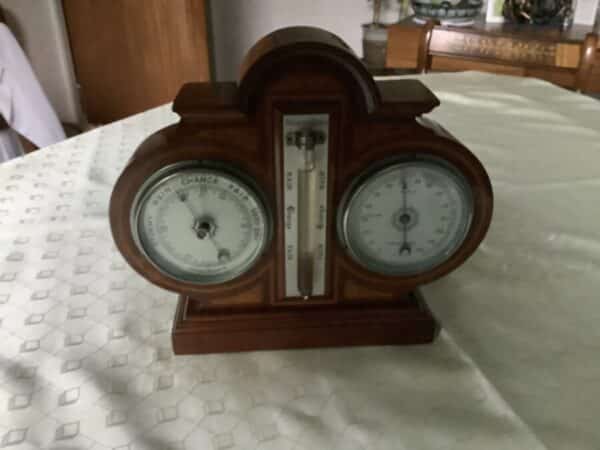 AN INLAID WEATHER STATION- BAROMETER/THERMOMETER/STORM PHIAL