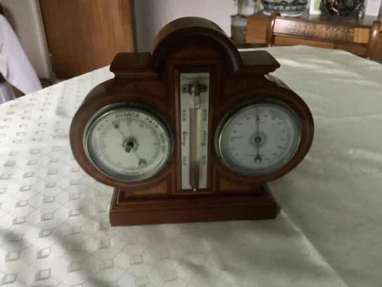AN INLAID WEATHER STATION- BAROMETER/THERMOMETER/STORM PHIAL