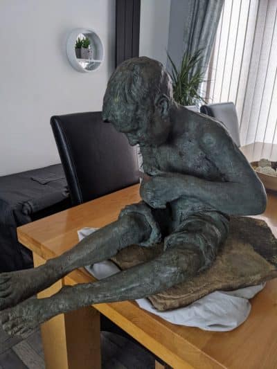 Garden sculpture by Robert Howard cook USA  the whittling boy bronze sculpture