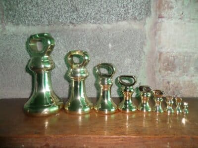 A SPLENDID SET 7lb to 1/2oz BUTCHER'S BRASS WEIGHTS.1920-1960's