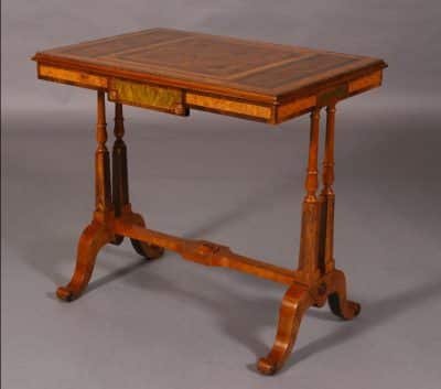 Regency revival walnut and specimen woods rectangular stretcher table.