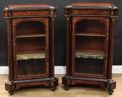 A pair of Victorian amboyna side cabinets