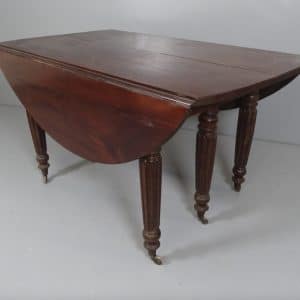 A Georgian extending drop leaf table. A Georgian extending drop leaf table Antique Tables 3