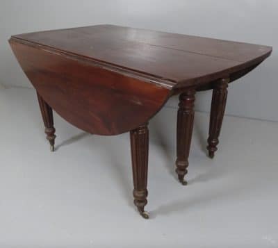 A Georgian extending drop leaf table. A Georgian extending drop leaf table Antique Tables 3