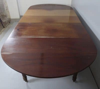A Georgian extending drop leaf table. - Image 2
