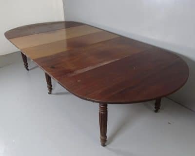 A Georgian extending drop leaf table. A Georgian extending drop leaf table Antique Tables 5
