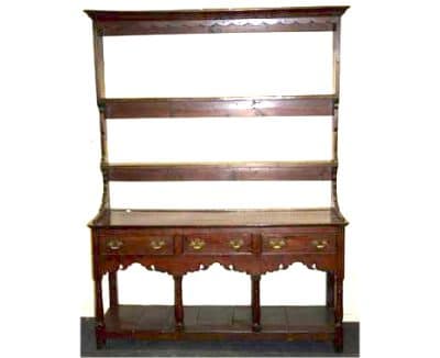 A Geo III oak  pot board dresser and delft rack