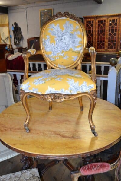 French Gilt Fauteuil upholstered in Gold Toile de Jouy fabric